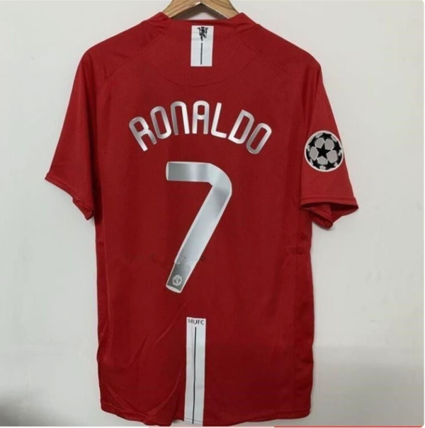 Ronaldo Manchester United vintage soccer jersey: A red and white jersey with Ronaldo's name and number.