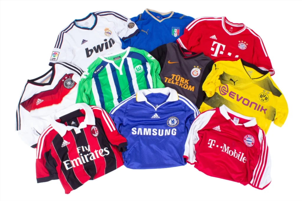 A group of soccer jerseys from different teams and organizations.