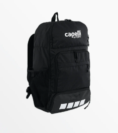 Black Capelli Sport team backpack featuring a large main compartment, a lower zippered compartment (for shoes or a ball), and side mesh pockets. The bottom front has four white squares for detailing.