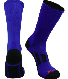 Pair of high-cut athletic socks in solid royal blue with black contrast areas on the heel, ankle, and arch, shown from the front and side view. The socks have a visible orange TCK logo on the toe area.